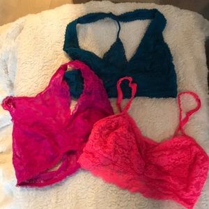 Three Victoria’s Secret lace bralettes